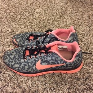 Animal print and pink nike shoes